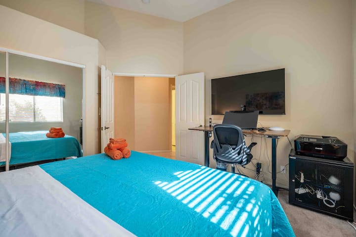 Double door entry for our office bedroom featuring an adjustable standing desk