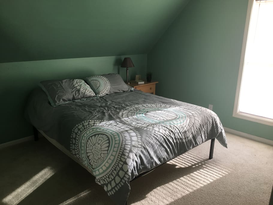 The bedroom is on the second floor. It's in the back of the house, so quiet and gives you privacy. You enter the bathroom from a hallway door located right next to the bedroom.
