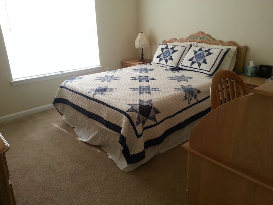 Private bedroom with solid wood furniture and 100% cotton bedding