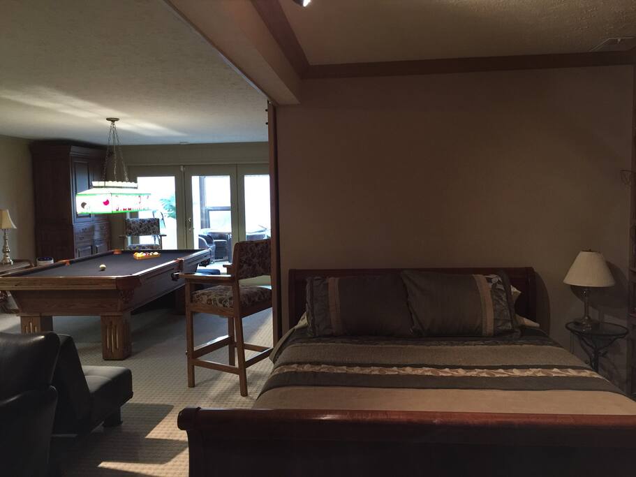 Queen bed and pool table