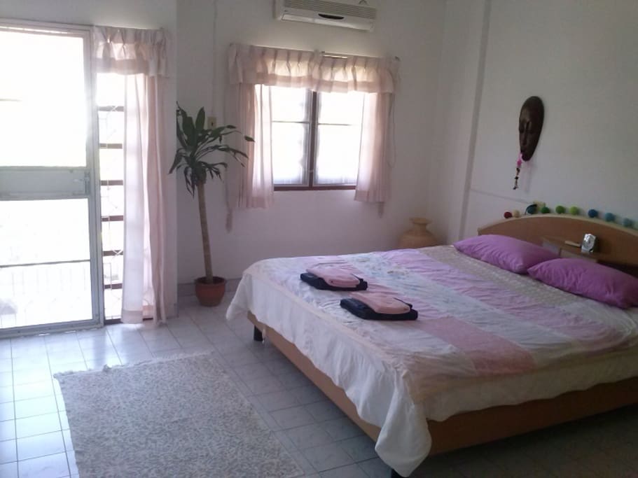 Master bedroom with small balcony