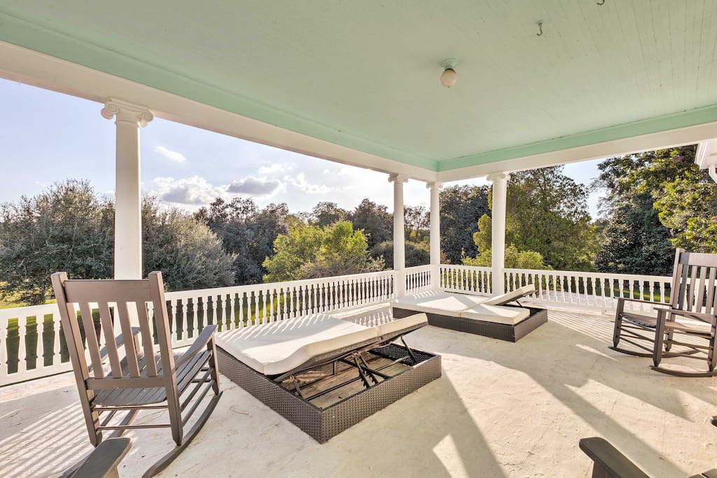 The property features a beautiful porch as well as a second floor balcony.