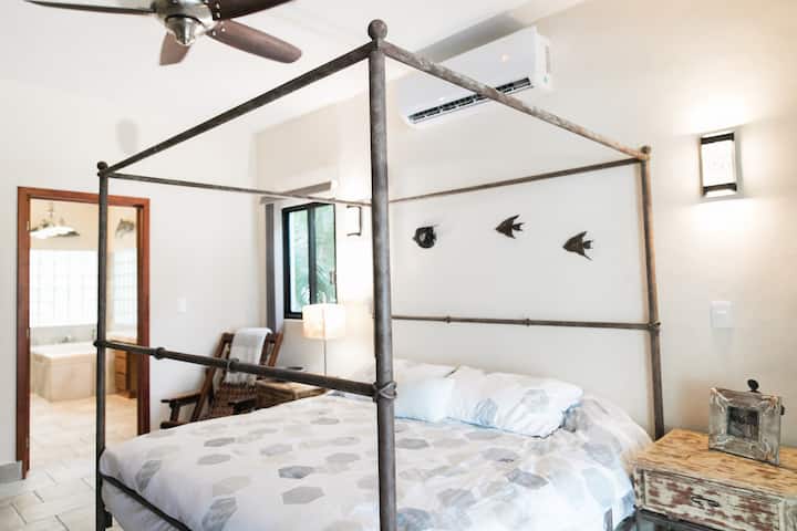 There is a King Suite with full bath on the first floor. It has a TV with cable and Netflix. It has a jetted tub and walk in shower. Glass block assures it is light and bright.