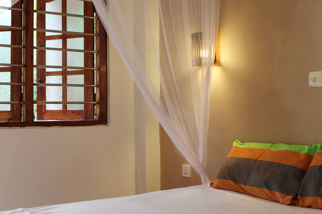 Clean, bright, newly decorated bedroom with new mattress and fan