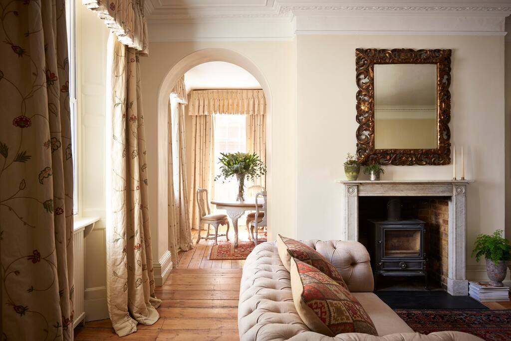 Spacious sitting room with wood burning stove