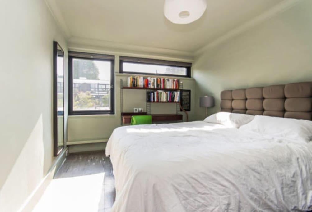 King-size bedroom with desk and plenty of clothes storage