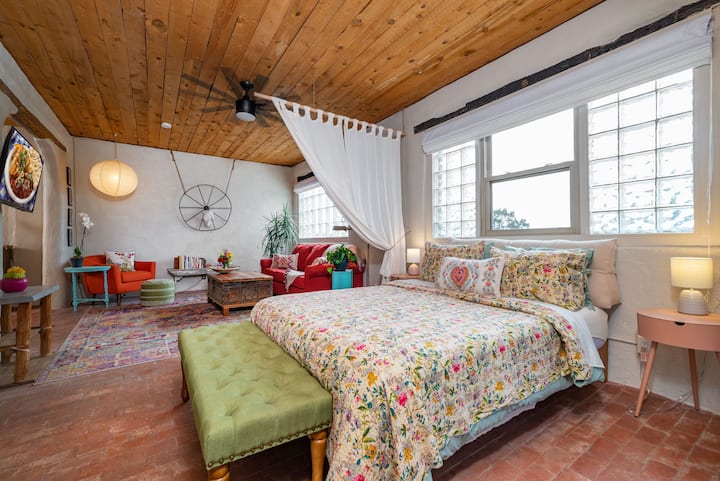 This super comfy queen bed has satin soft sheets, a down comforter and a pillow headboard for luxurious lounging to read or watch movies from bed!