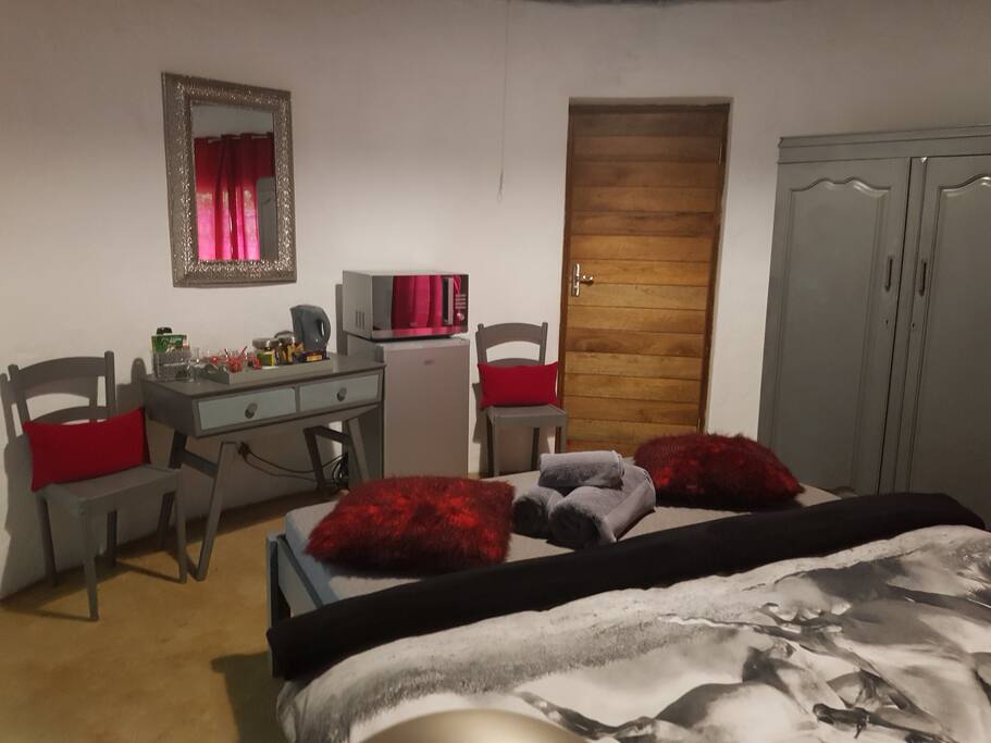 Coffee station, microwave and bar fridge with sleeper couch.