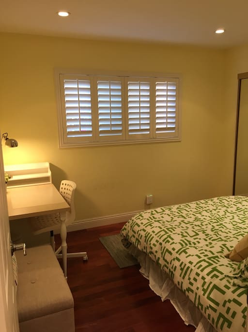Room highlights - Queen sized bed, Side bed table with lamp, Desk table with plenty of drawers, Study lamp, Storage bench, Lutron adjustable ceiling lights switch, Wood flooring, Big windows with wooden shutters, Wall-to-wall glass sliding doors for the closet.