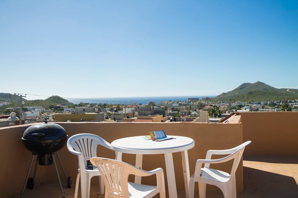 Partial rooftop with views. There are also several chez loungers to suntan.