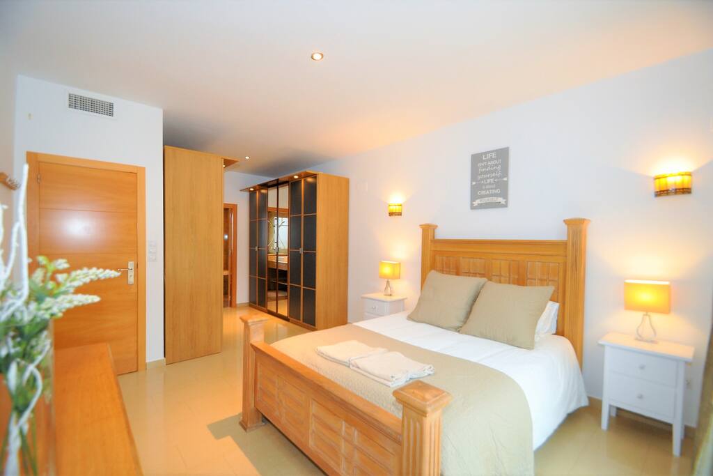 Upstairs master with ensuite and patio doors to the orchard