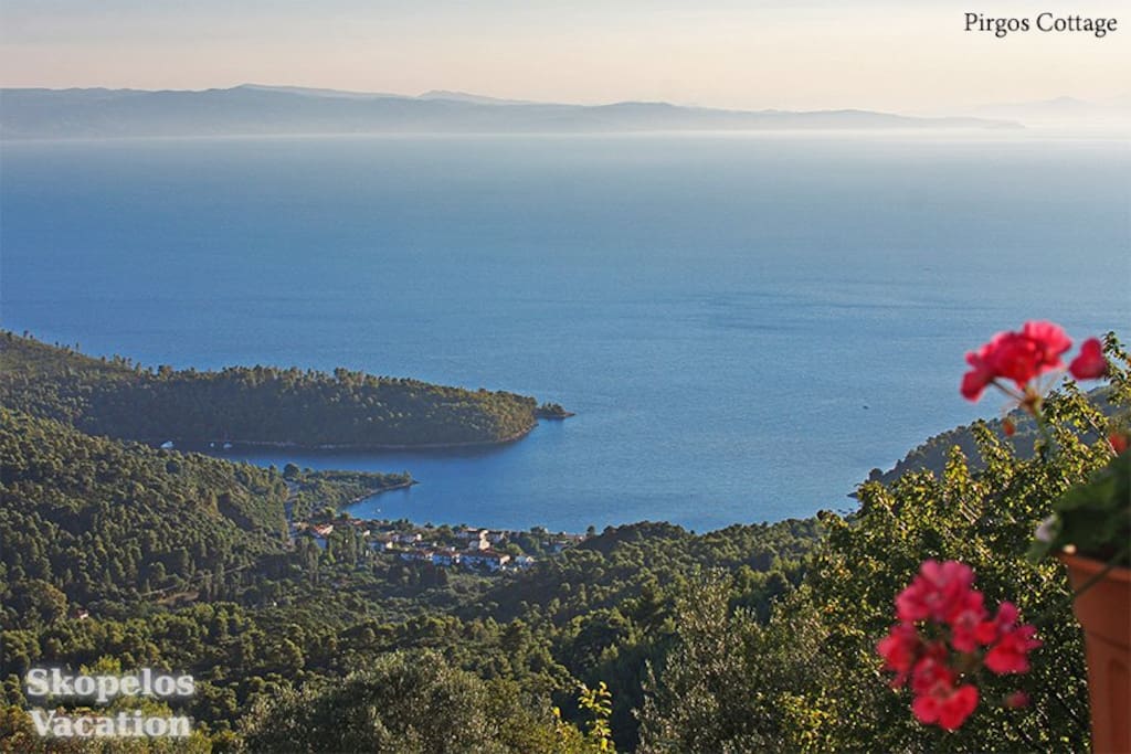 With beautiful view to Panormos, Aegean Sea and Evia Greece island.