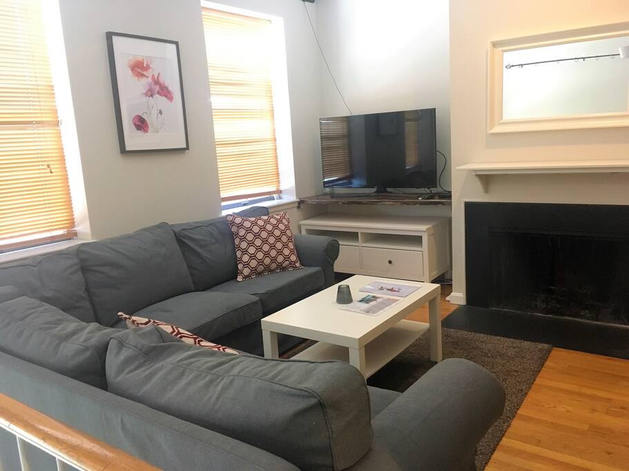 Living room with TV and Indoor Fireplace