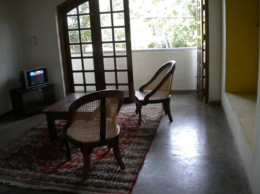 Television with windows opening out to the balcony