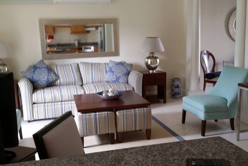 Living Room opens to Kitchen & bar with movies, big screen