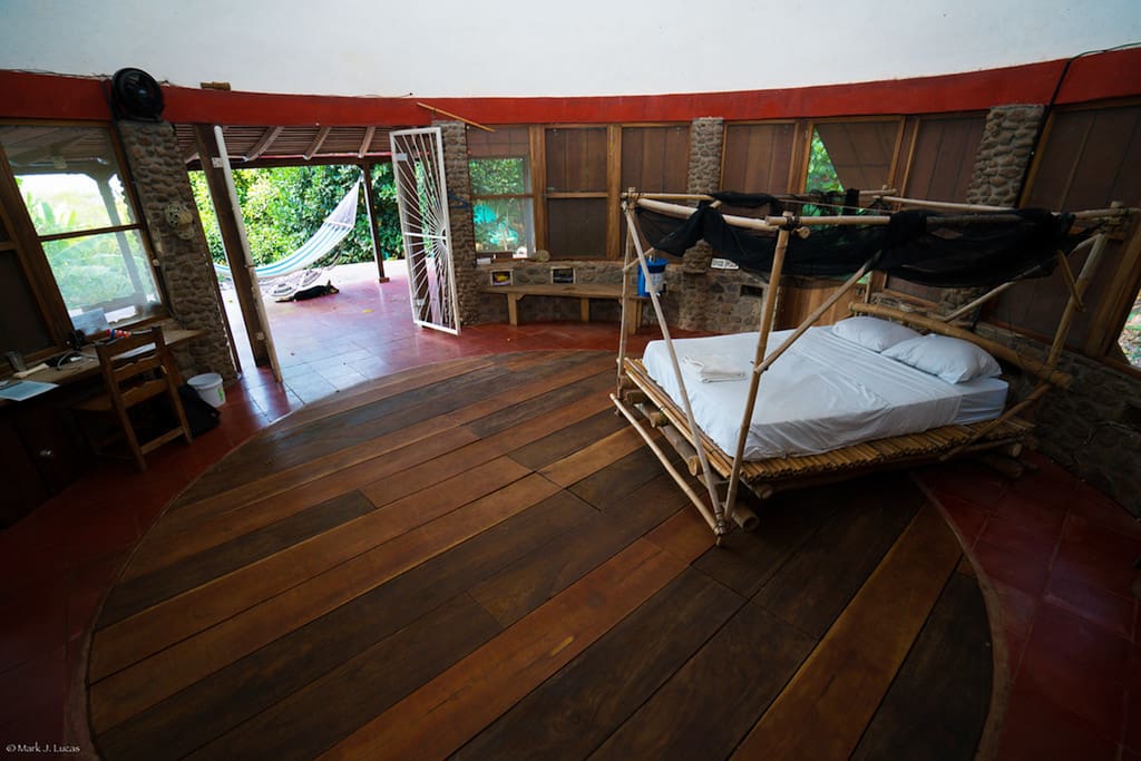 Bedroom looking out. Double doors open to front porch