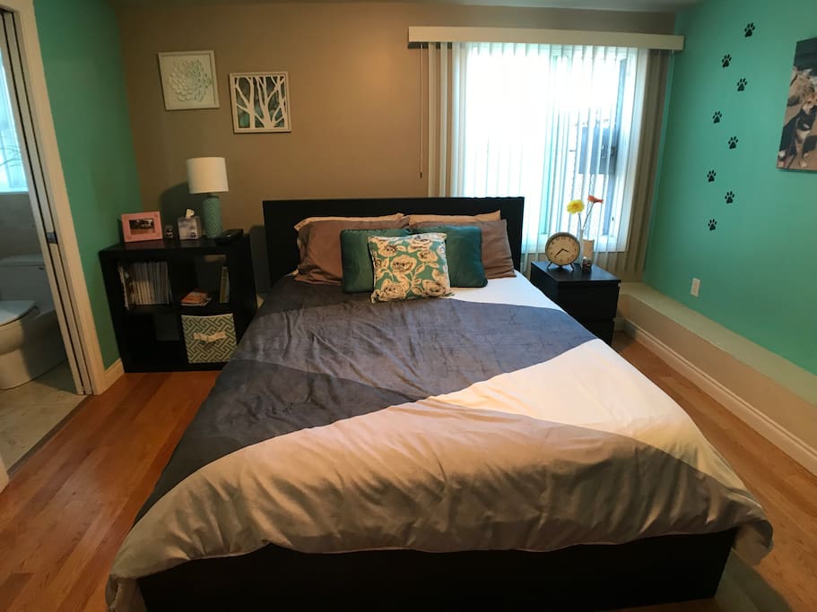 The stylish comforter and furniture adds to the modern appeal of this living space.