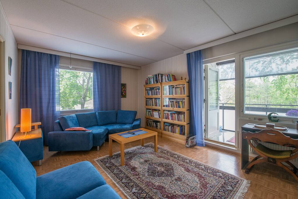 Living room sofas and entrance to balcony.