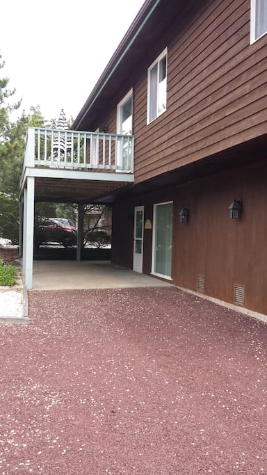 Car port, driveway, and balcony