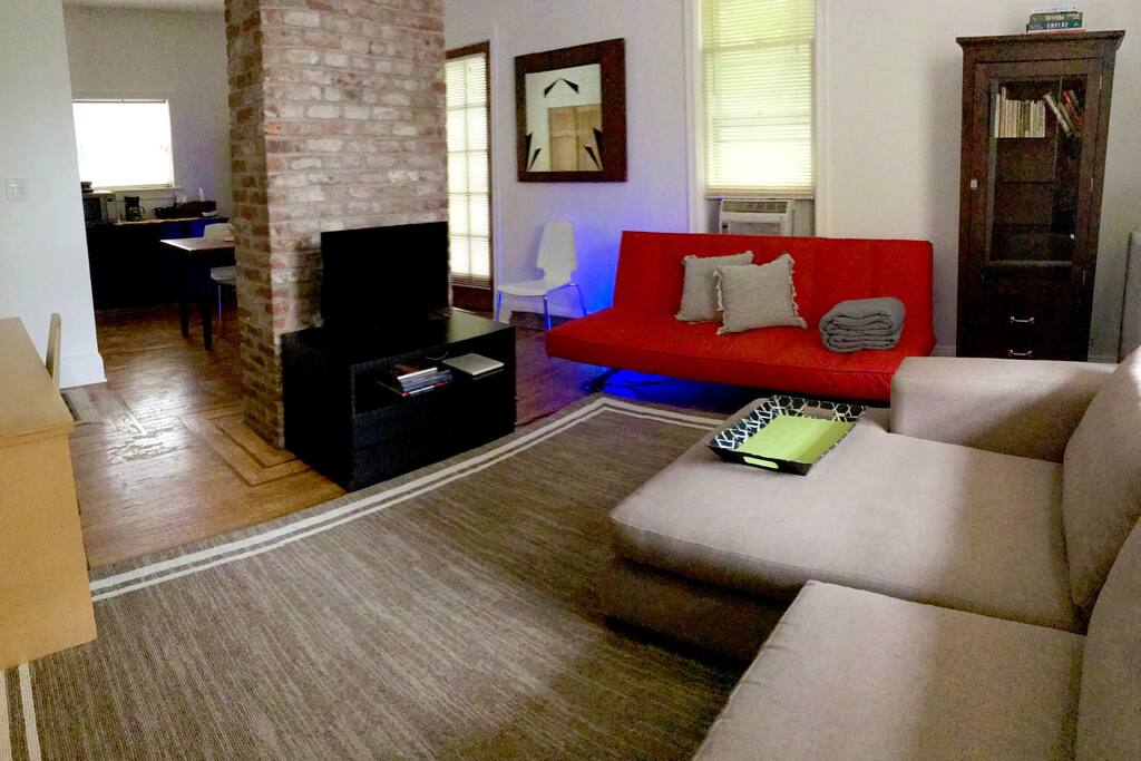 Living Room with Red sofa folds out to queen bed