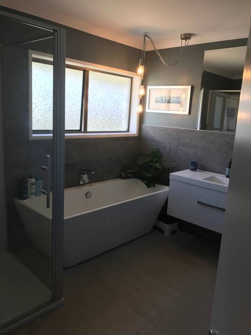 Main bathroom with shower and bath