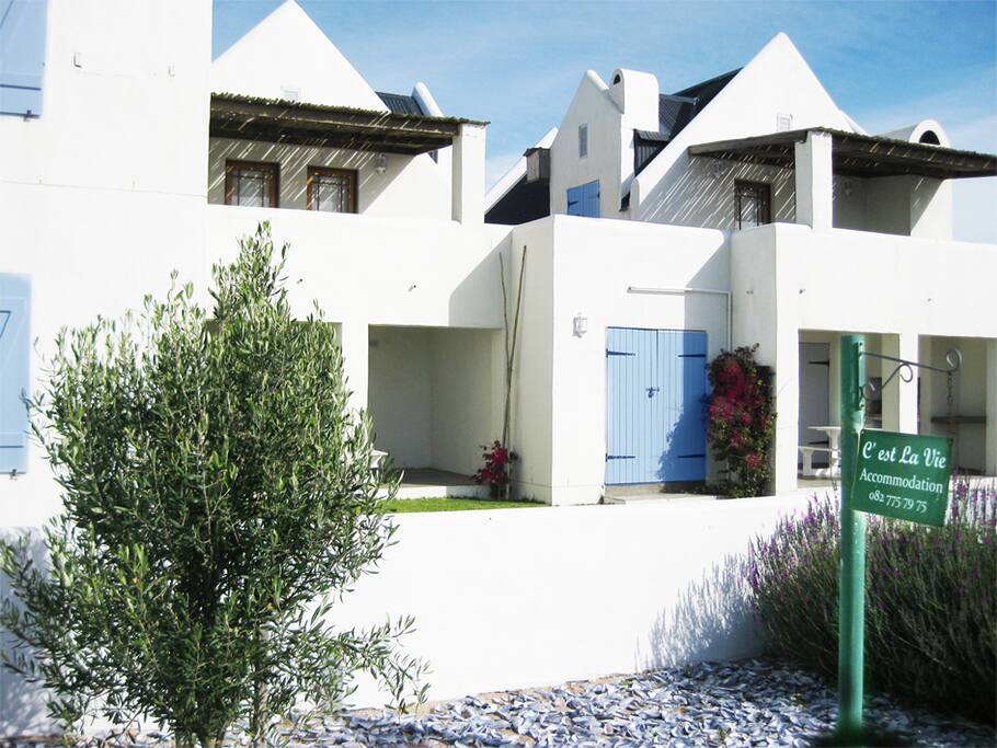 Tastefully decorated in Mediterranean/French country style. Cottage 1 to the right and 2 to the left. Enclosed garden for safety of children.