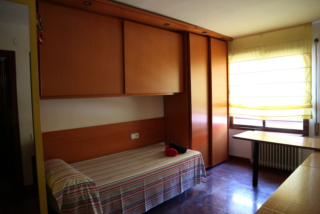 The room is exterior. The window has a blind / vertical shutter in order to keep the sun out. There are also curtains in case you want to feel the Mediterranean sun but not that much ;)