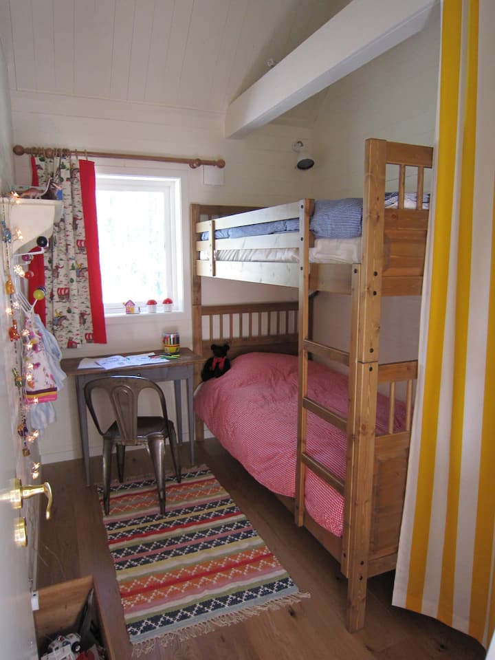 Bedroom #3:  Bunk bed and 2 single beds on the sleeping loft up to the left. In total 4 beds in this room (Main house)