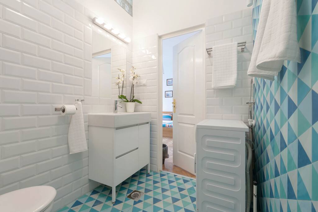 the apartment has a fully equipped bathroom with everything you might need, from the washing machine to the hairdryer