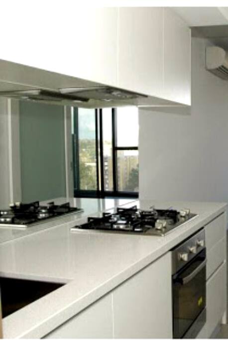 Modern kitchen with gas top.
