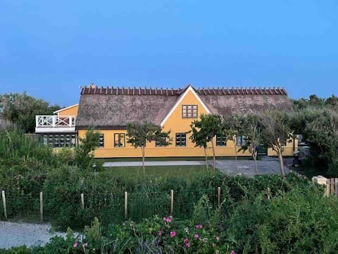 Historic four-length farm with its own beach plot