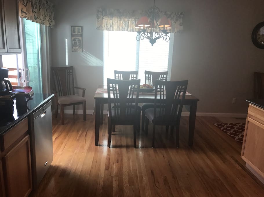 Dining table seats 6 comfortably without extension. Add leaf to seat 4 more. Folding chairs available.
