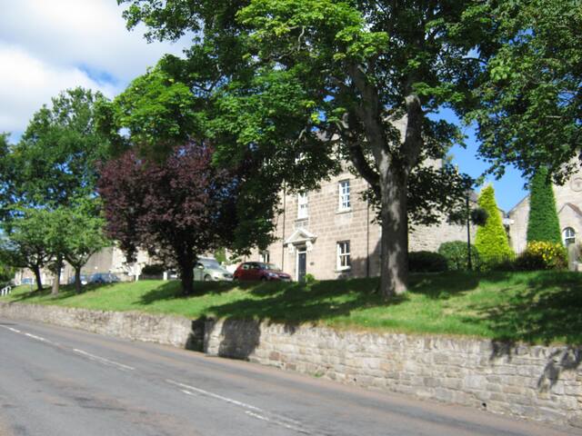 Georgian house within village with valley views.