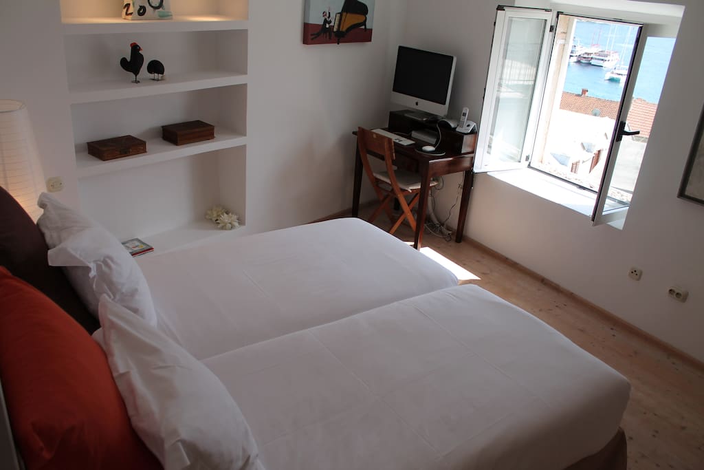 Room with see view, working table, air conditioning, bathroom attached to the room, situated on the 2nd floor in the house