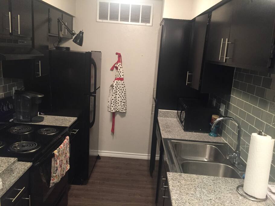 Kitchen- has microwave, Keurig, stove top, oven, pots/pans/dishes, various spices