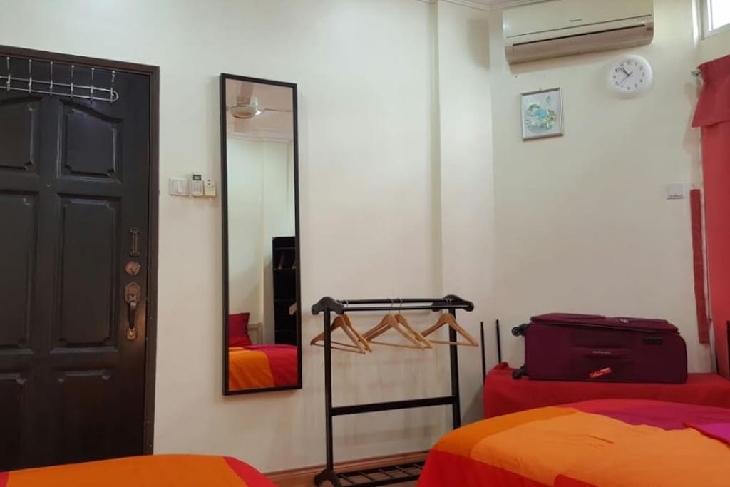 Place to hang your cloths and a long mirror to indulge yourself.