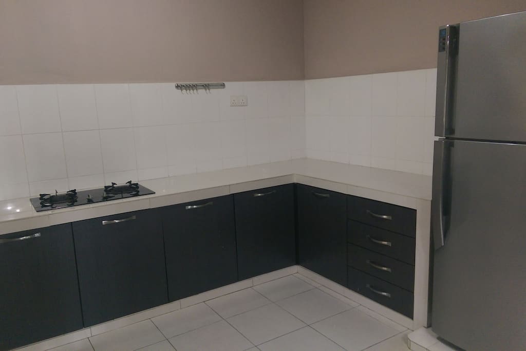 Kitchen area for light cooking. Fridge and induction cooker and electric kettle provided