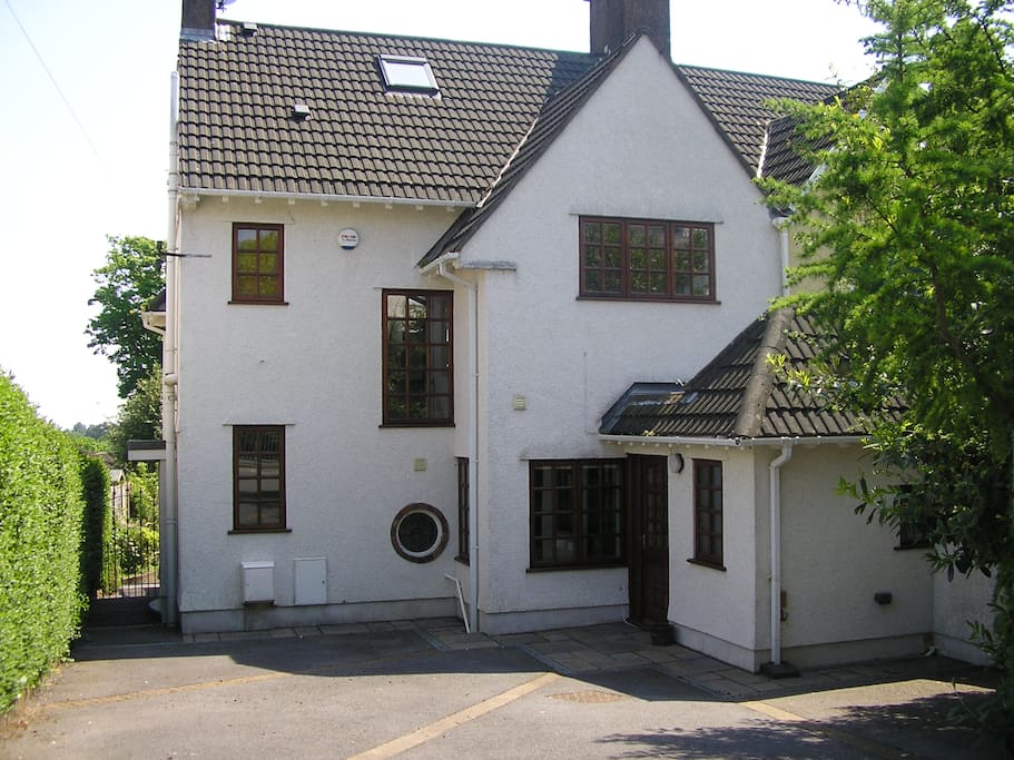 Front exterior with driveway for 3 cars