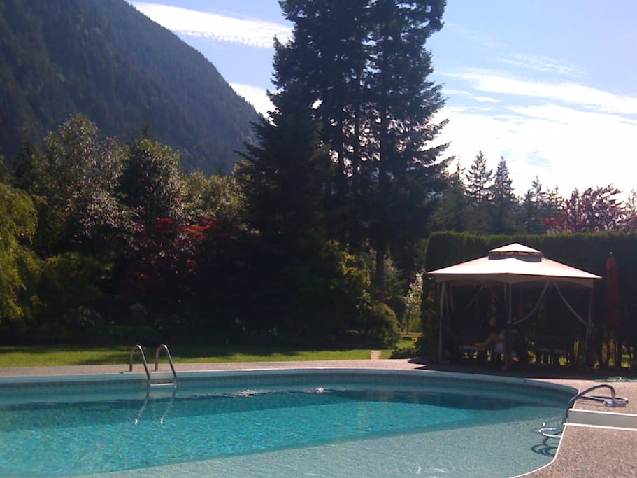Peaceful and warm summer afternoon - relax on the pool deck and gazebo
