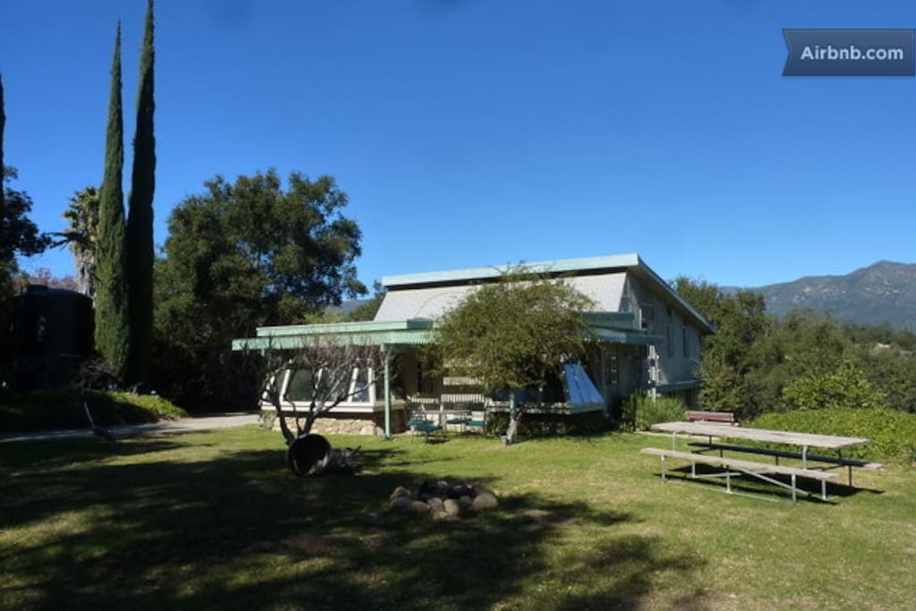 The Chalet sits on the north side of the hill. A large yard with huge oaks, fruit trees occupies most of the hill top