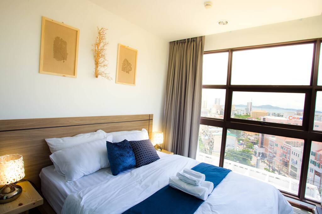 Cozy Bedroom with Floor to Ceiling Windows