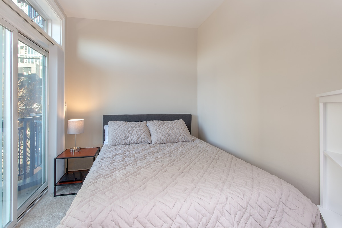 Queen memory foam bed, with city views.