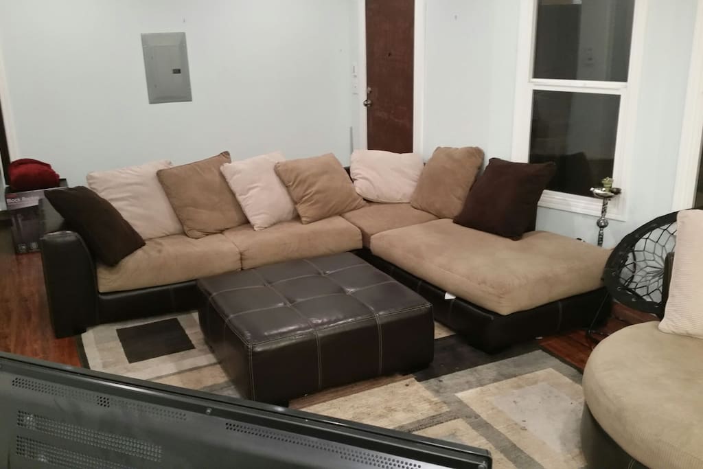 Large cozy comfortable L shaped couch (can be rented separately for cheaper!) with large swivel chair.
We use this space for hosting game nights and watch parties