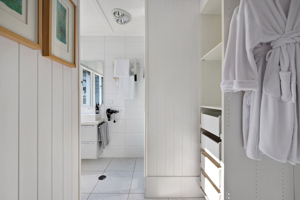 The fresh ensuite, with storage and walk in shower