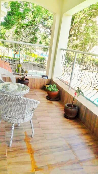 Take a break and catch the breeze on the balcony as you contemplate a dip in the pool below for that stunning summer tan