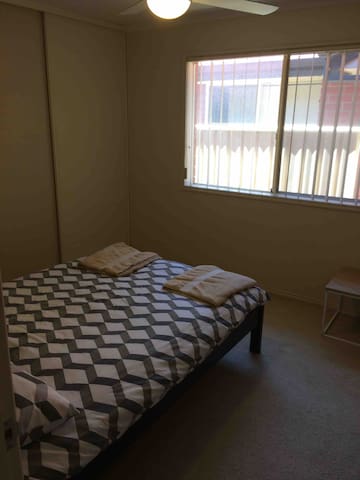 clean tidy room with double bed and built inns