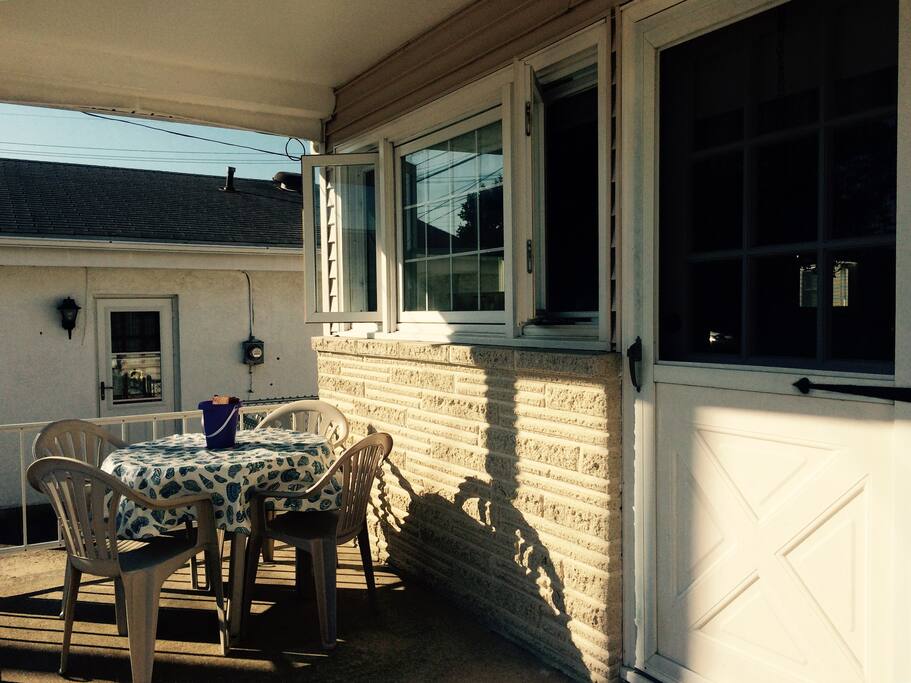 Front porch with tables and chairs