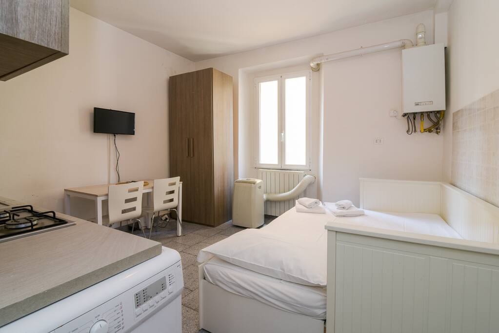 Living room with bed & equipped kitchen