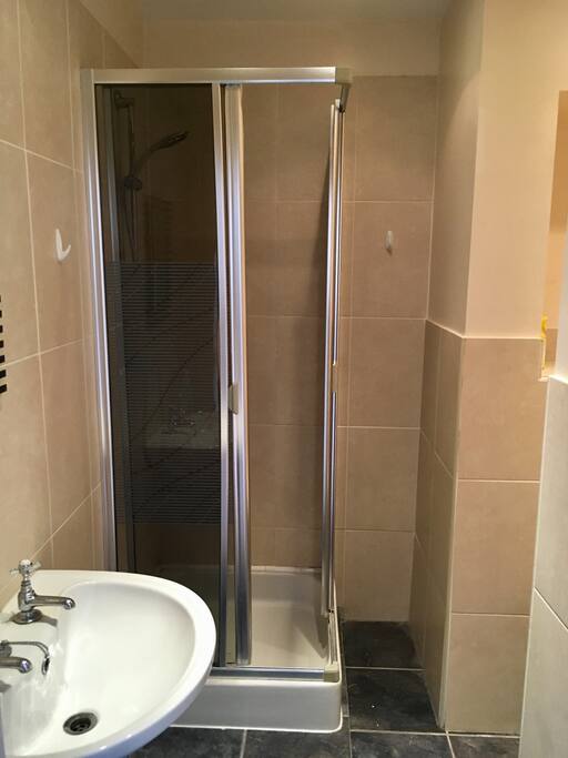 Private bathroom with shower, sink and toilet