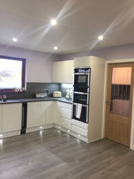 Newly renovated modern kitchen and dining room. perfect place to get together to cook chat and chill.